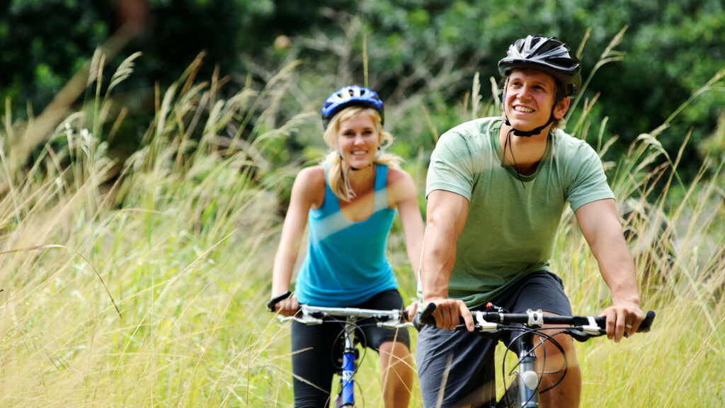 Happy young couple on bikes